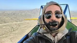 Flying an open cockpit biplane