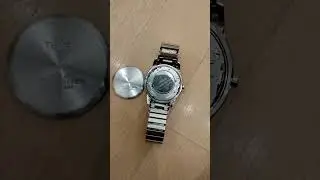 Trying To Put A Battery Cover Back On The Back Of An Analog Timex Watch, 9/11/23