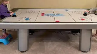 Hahn kids play air hockey...