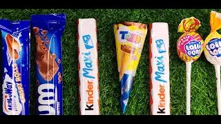 Colorful scene with Kinder chocolate treats and sweet Chupa Chups lollipops.🍭🍫🍫