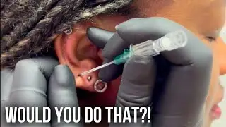 Ear Piercing with needle 💉 Would you do this? #piercing
