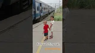 kids watching local train arrival
