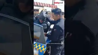 Batman Busted! Caped Vigilante Takes an Unplanned Trip to the Station