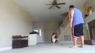 Baby tries to play hacky sack