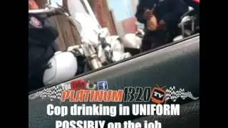 Cop drinking in uniform possibly on the job