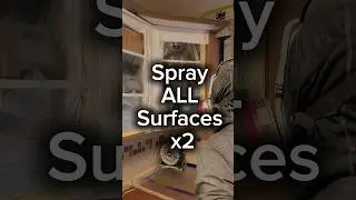 spraying the primer on kitchen cabinets with Bin shellac