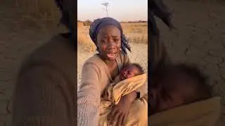 A young African woman sitting in a rural village surrounded by dry  barren #god #duet #ruralarea #hd