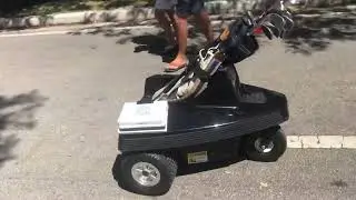 Tempo Walk, $4500 wireless electric bot golf caddy by Club Car auto follows you across golf course.