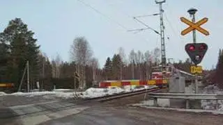 Finnish Express train 704 passing Tiril&auml; level crossing