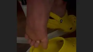 Crocs shoeplay and candid feet of my friend, dangling