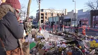 Visitors to Alex Pretti memorial in Minneapolis reflect on recent events, immigration enforcement