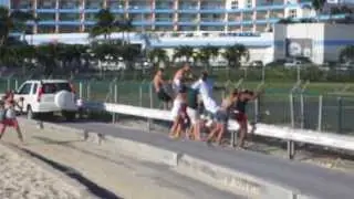 Spotters hanging off the fence while MD80 takes off in Saint Martin