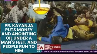 Pr. Kayanja Puts Money and Anointing Oil Under a Man's Feet, and People Run to Him