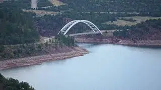 Stock Video - Panning the shoreline at Flaming Gorge and Cart Creek Bridge
