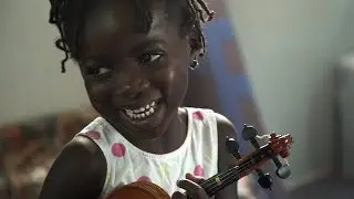 Teaching violin at a refugee camp in Greece