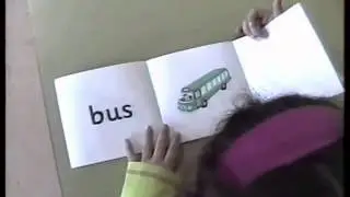 Reading a Jolly Phonics 'Read and See' book