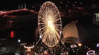 Chicago Navy Pier Ferris Wheel Lights Show from Aerial View at Night on Lake Michigan Shoreline