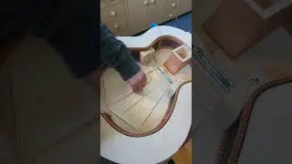 Tuning the soundboard of an acoustic guitar #handcraftedguitars #acousticguitar #acousticdesign