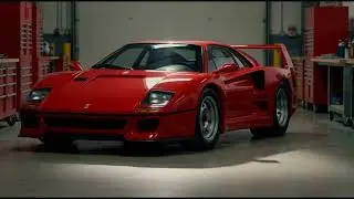 Red supercar parked in modern automotive workshop garage