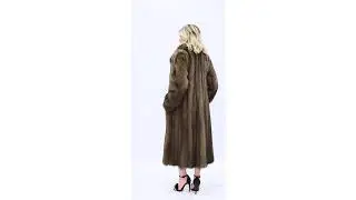An elegant coat with an English collar made of Canadian fisher fur Nafa Northern.