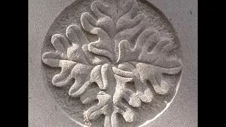 Carving oak leaves in York stone