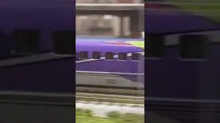 Pennsylvania F Unit Leads Manifest Train with Bullet Train coming to a stop