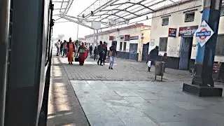 Bharatpur Kasganj Passenger departing Hathras City Railway Station and running parrelel to Highway