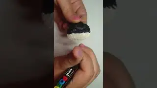 Drawing a night sky on a sea shell!