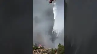 The SkyCrane drops a load from the belly tank.  #wildfire #helicopter  #aviation