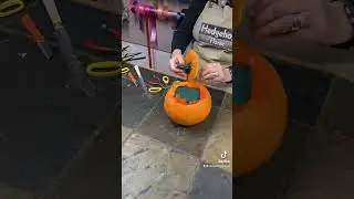 Making a Floral pumpkin arrangement . Pumpkin fun in the flower shop