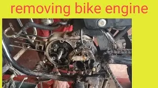 Removing the bike engine/ ಬೈಕಿನಿಂದ ಬೈಕ್ ಎಂಜಿನನ್ನು ತೆಗಿತಾ ಇರುವುದು 