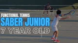 7 year old striking with the Functional Tennis Saber Junior
