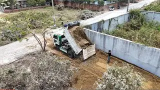 New Project Dump Truck Working Unloading Soil Machinery DozerMini D20P Pushing soil Into Fence Stone