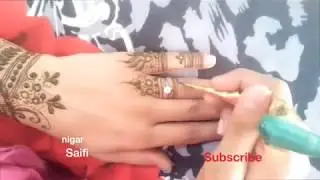 how to apply henna mehandi design by yourself on upper hand and with beautiful fingers designs .