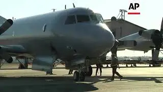 Australian P3 Orion returns to base after searching for missing flight MH370