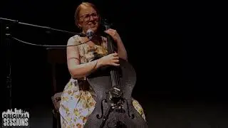 Sidewalk Cellist   Pacific Rain & Trickle Down by Clara Shandler