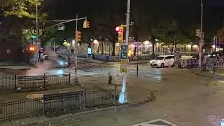 Open top bus drive through New York at night
