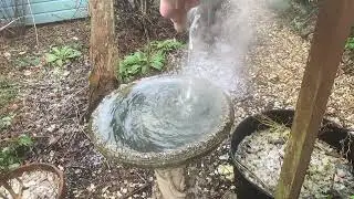 Boiling water in frozen bird bath - slow motion