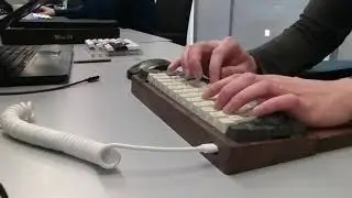 Co-worker's first custom mechanical keyboard build: wooden case