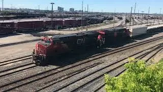 CN Train Departs MacMillan Yard Vaughan Toronto Ontario CN 2864 3877 Passing CN GP9RM 7276 Slug 276