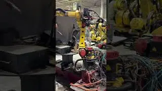 Genesis dual arm mig welding cell for sale.