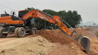 MÁY XÚC DOOSAN DX140 VÀ XE TRỘN BÊ TÔNG CÙNG MÁY ỦI TẠI CÔNG TRÌNH XÂY DỰNG ĐƯỜNG GIAO THÔNG