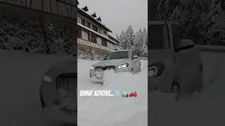 BMW iX1 plowing through deep snow