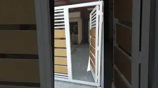 gate white color with hardie plank maple color design
