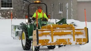 Nick's Snow & Mow plowing with a Deere 3032E