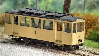 A special model railway layout in HO scale with two track gauges for tramways and freight transport