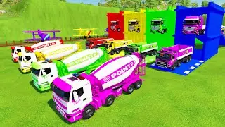 Красочная тяжёлая машина &mdash; красочный бетоносмеситель, самосвал Volvo FMX, перевозящий груз в гара...