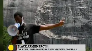 Black Armed protesters march through Confederate memorial park in Georgia