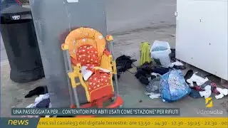 Una passeggiata per...Rifiuti abbandonati vicino il contenitore per abiti usati