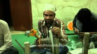 Artisans work at a marble inlay factory in Agra